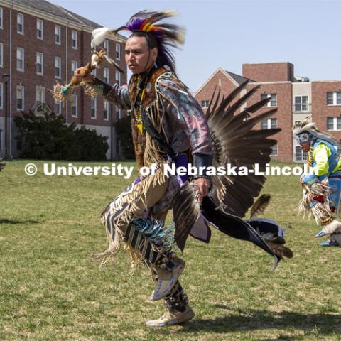 Maurice Phillips dances during the 2022 UNITE powwow. 2022 UNITE powwow to honor graduates (K through college). Held April 23 on the greenspace along 17th Street, immediately west of the Willa Cather Dining Center. This was UNITE’s first powwow in three years. The MC was Craig Cleveland Jr. Arena director was Mike Wolfe Sr. Host Northern Drum was Standing Horse. Host Southern Drum was Omaha White Tail. Head Woman Dancer was Kaira Wolfe. Head Man Dancer was Scott Aldrich. Special contest was a Potato Dance. April 23, 2023. Photo by Troy Fedderson / University Communication.